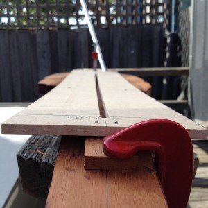 Re-grooving for the truss rod using an MDF template held in the correct curve.